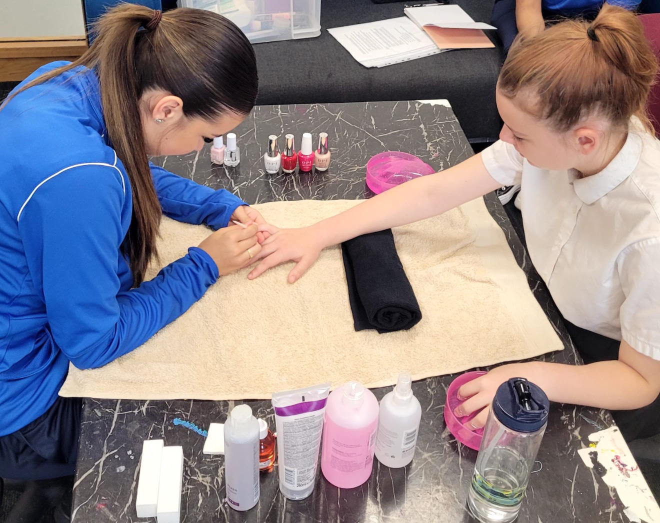 A practical beauty therapy lesson with an Evolution mentor supporting a student