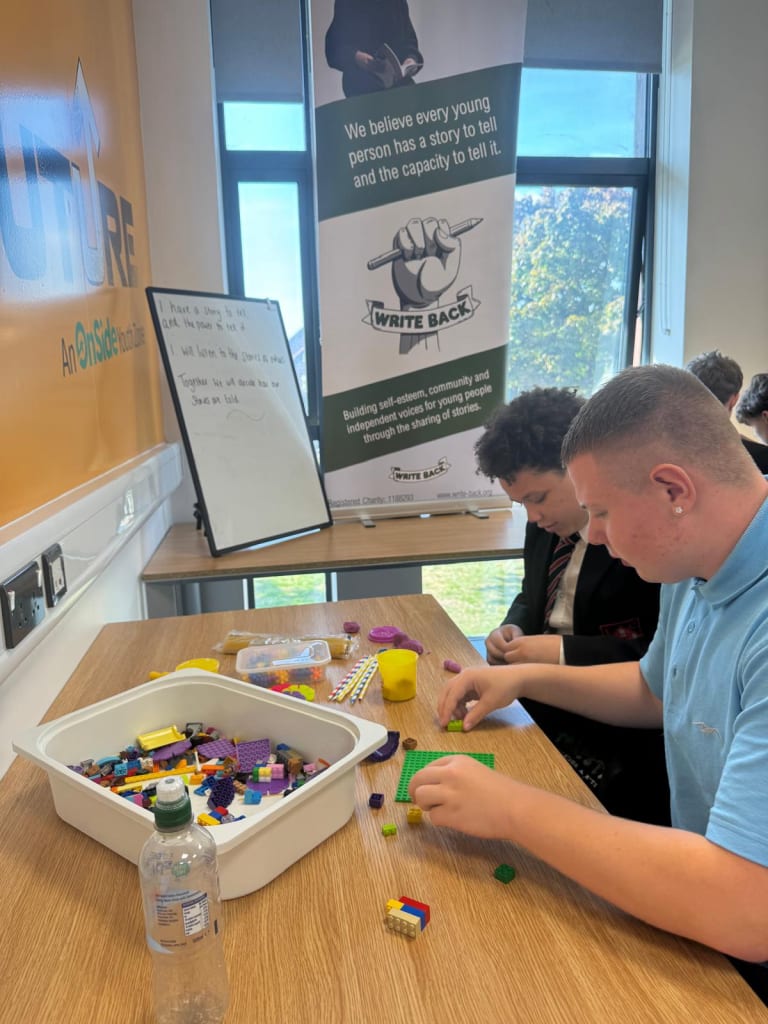 Students building and learning together during a creative workshop